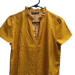 Gold shirt with white dots